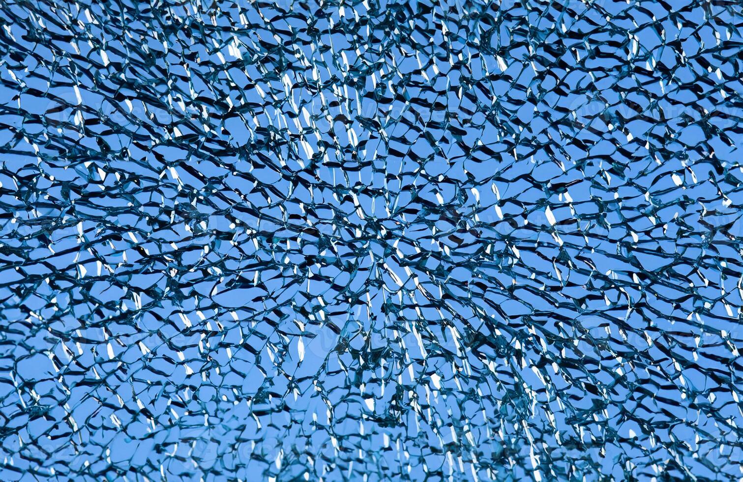 High-Resolution Close-up of Shattered Glass Surface, Abstract Background Texture photo