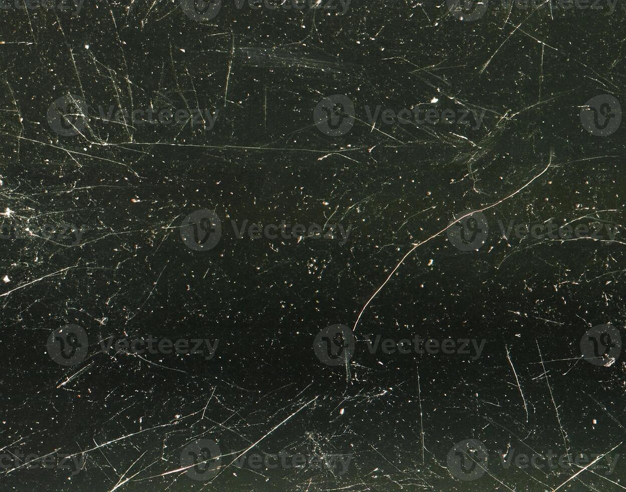 close up of black and white dust and scratches grunge overlay texture photo