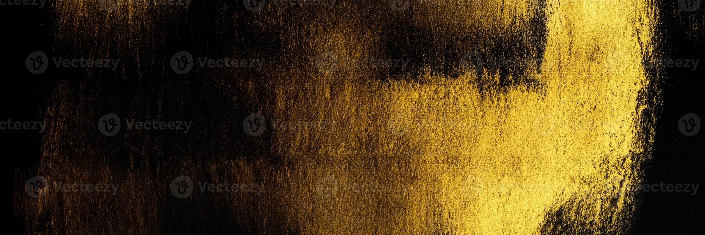 Acrylic Paint Stroke in Gold on Black Background photo