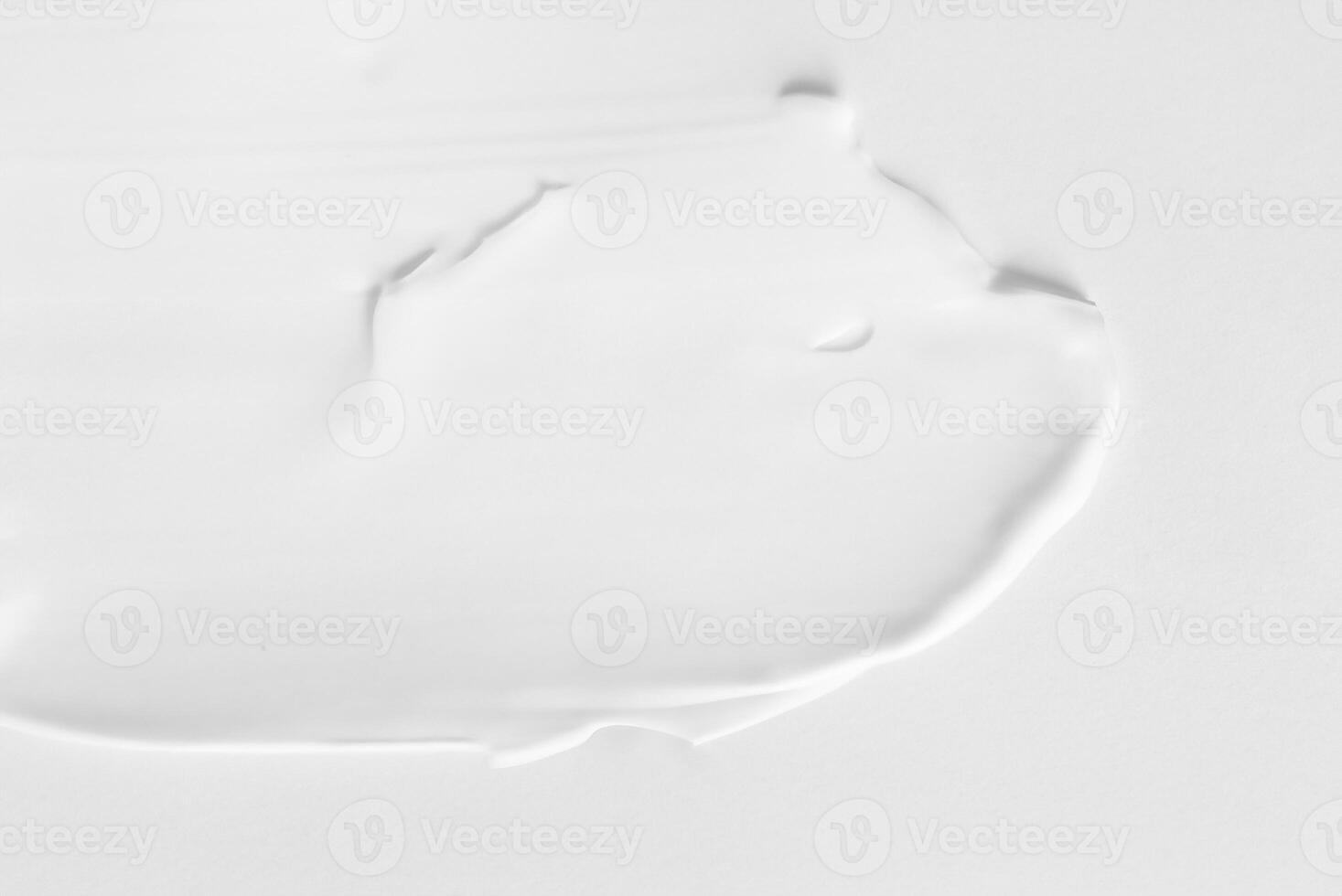 Close-up View of Thick White Cosmetic Cream Smears, Textured Background photo