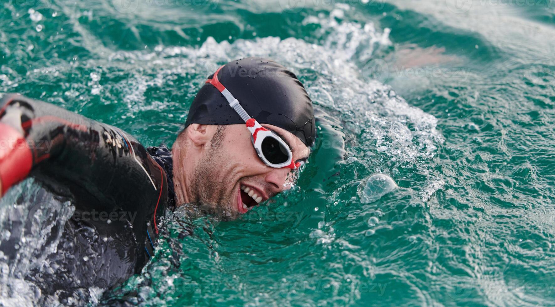 A professional triathlete trains with unwavering dedication for an upcoming competition at a lake, emanating a sense of athleticism and profound commitment to excellence. photo