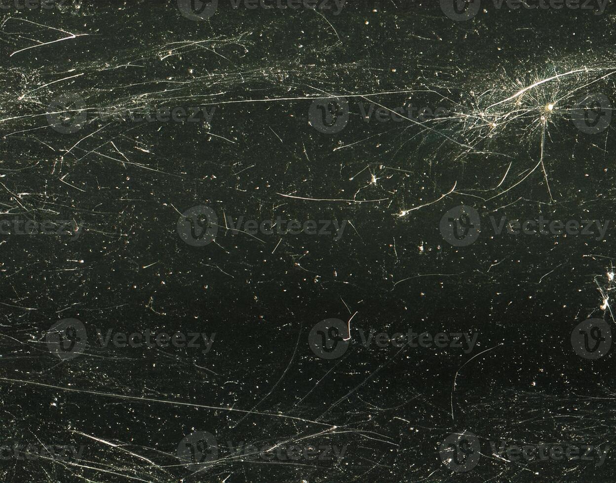 close up of black and white dust and scratches grunge overlay texture photo