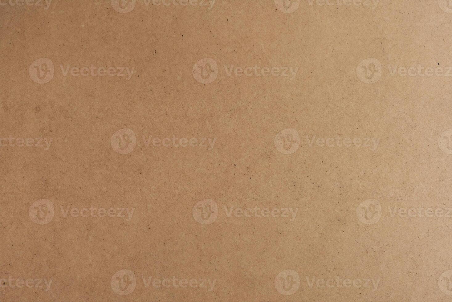 Horizontal Kraft Paper Texture Sheet on Cardboard Brown Background photo