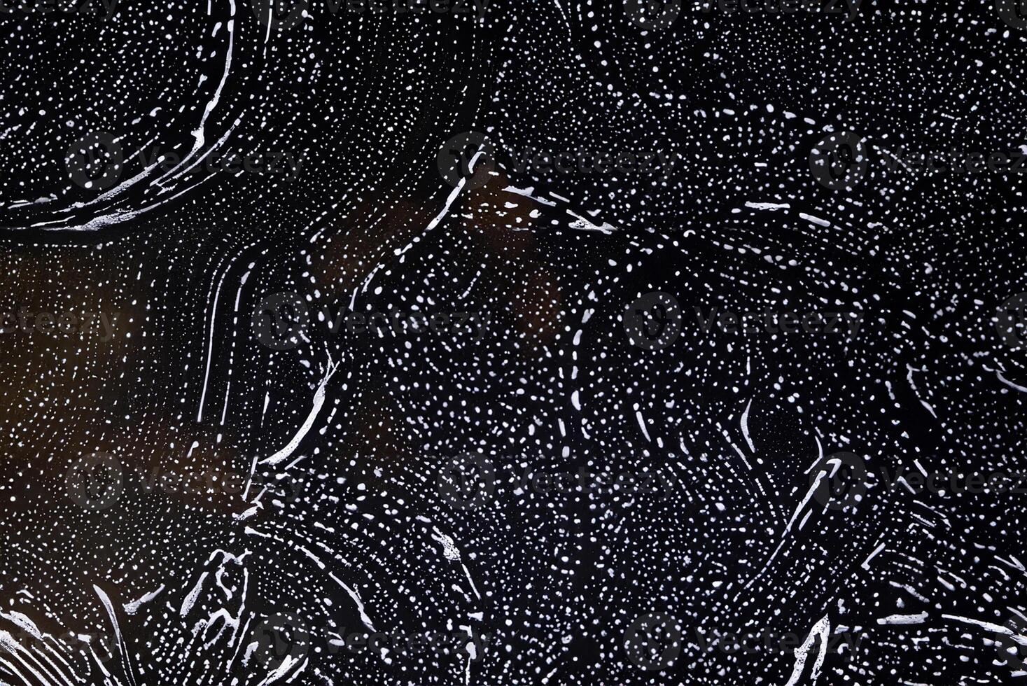 White Foam Texture of Detergent on Black Background photo