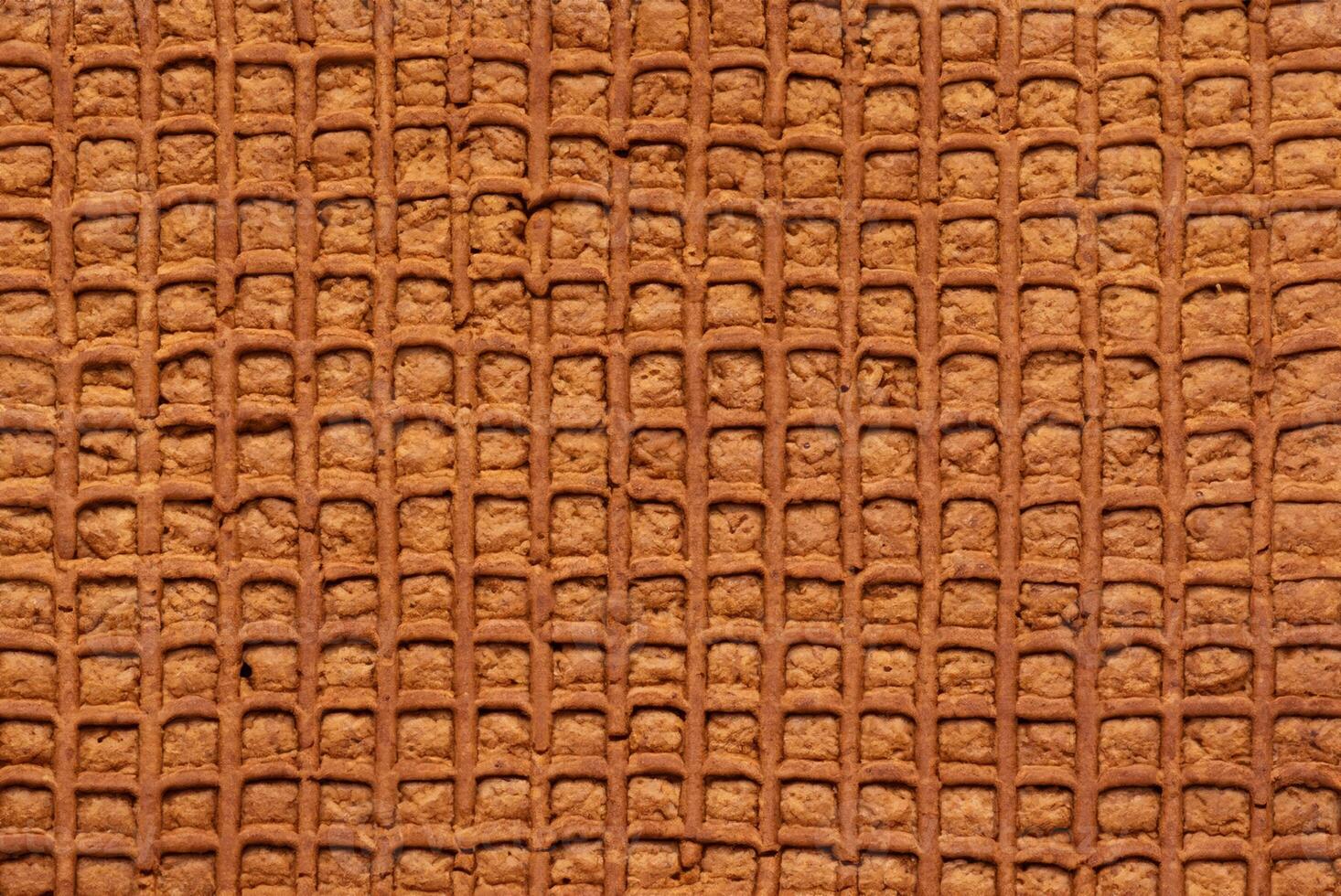 Close-up of Textured Brown Gingerbread, Symbolizing Festive Season Cooking and Holiday Celebrations photo