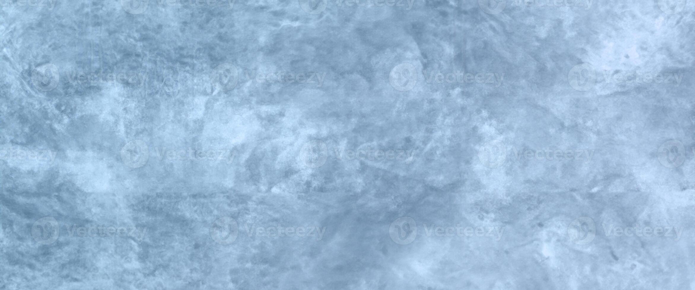 Winter-themed Abstract Background with Text or Image Space, Highlighted Blue Concrete Wall Texture, and Cloudy Distressed White Painting. photo