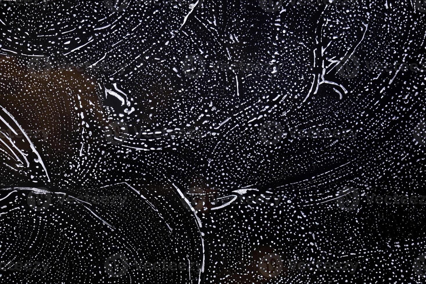 White Foam Texture of Detergent on Black Background photo