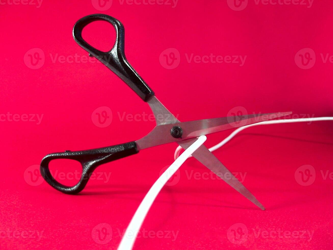 cutting wire with scissors - tech, internet, information and communication styled concept photo