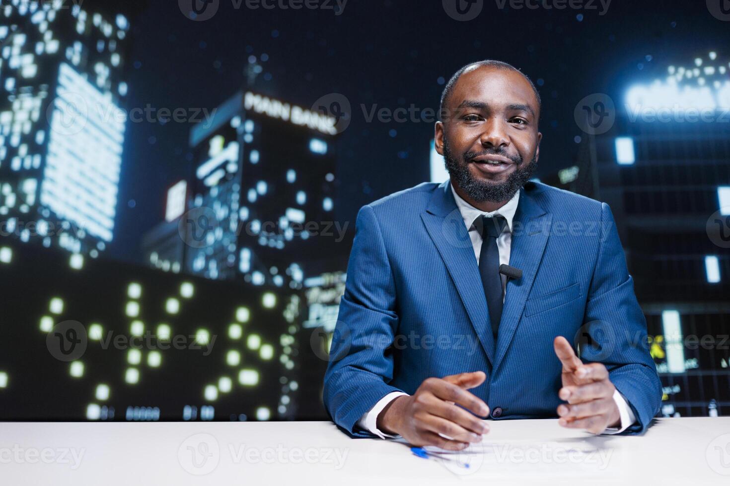 Media tv host reading headlines on live broadcast transmission from media outlets, african american man addressing news stories from newscast. Reporter reading essential information. photo