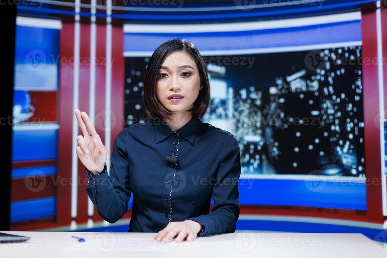 Presenter covering all breaking news topics and latest events occuring internationally, talking about issues in daily newscast reportage. Newscaster addressing celebrity drama in studio. photo