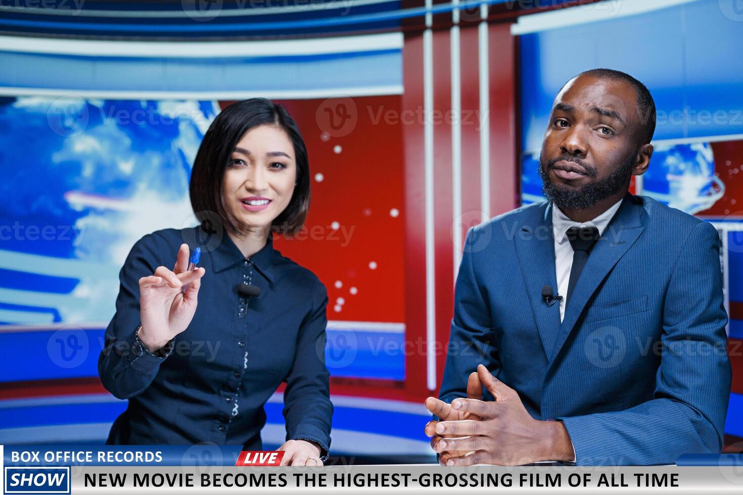 Reporters present new movie breaking charts, news report analysts talking about film bringing down box office records. Team of diverse journalists reading headlines, daily events. photo