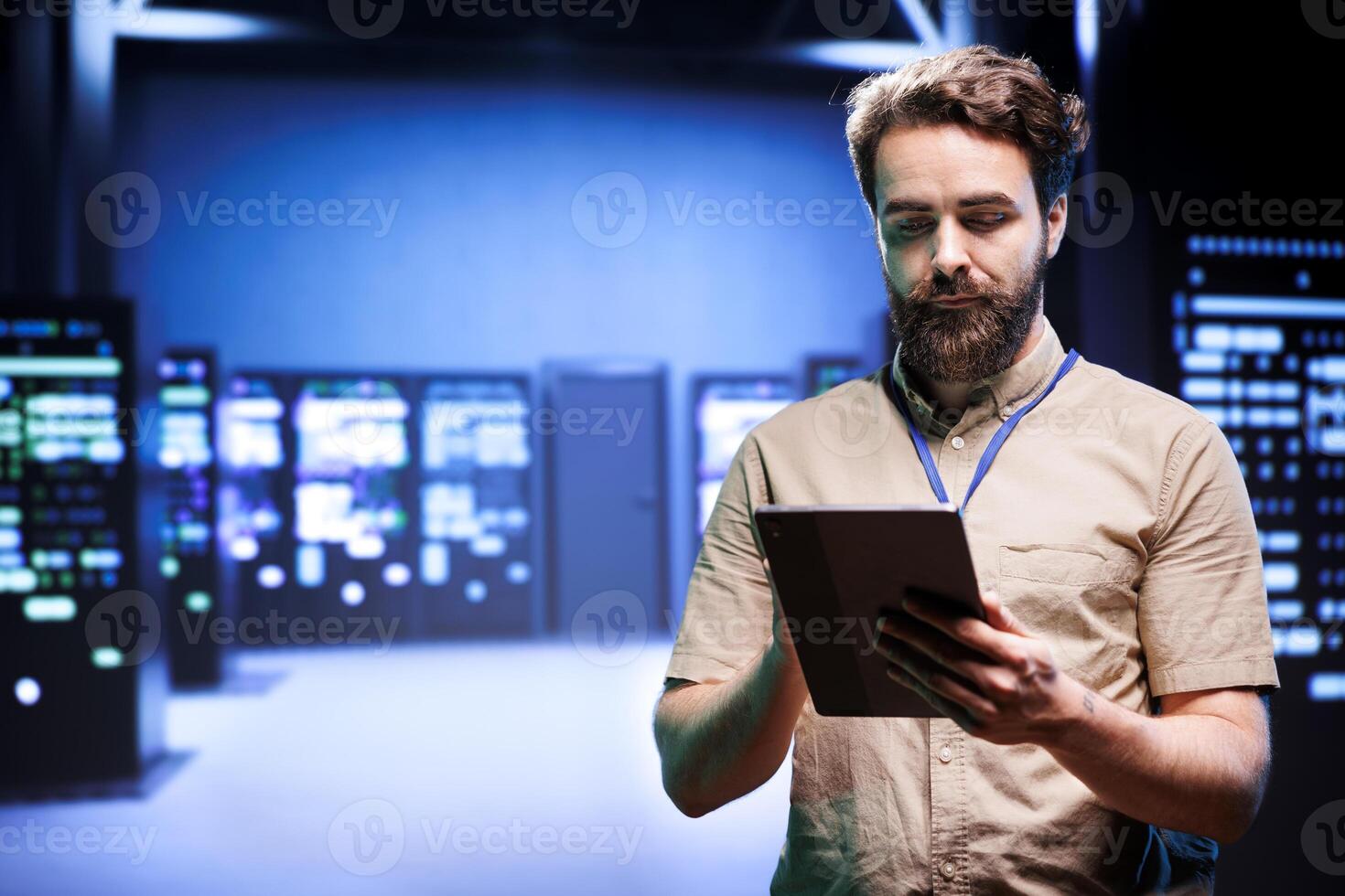 Manager in data center walking through server racks used for computationally intensive tasks such as quantum mechanics or weather forecasting. Specialist running annual equipment diagnosis photo