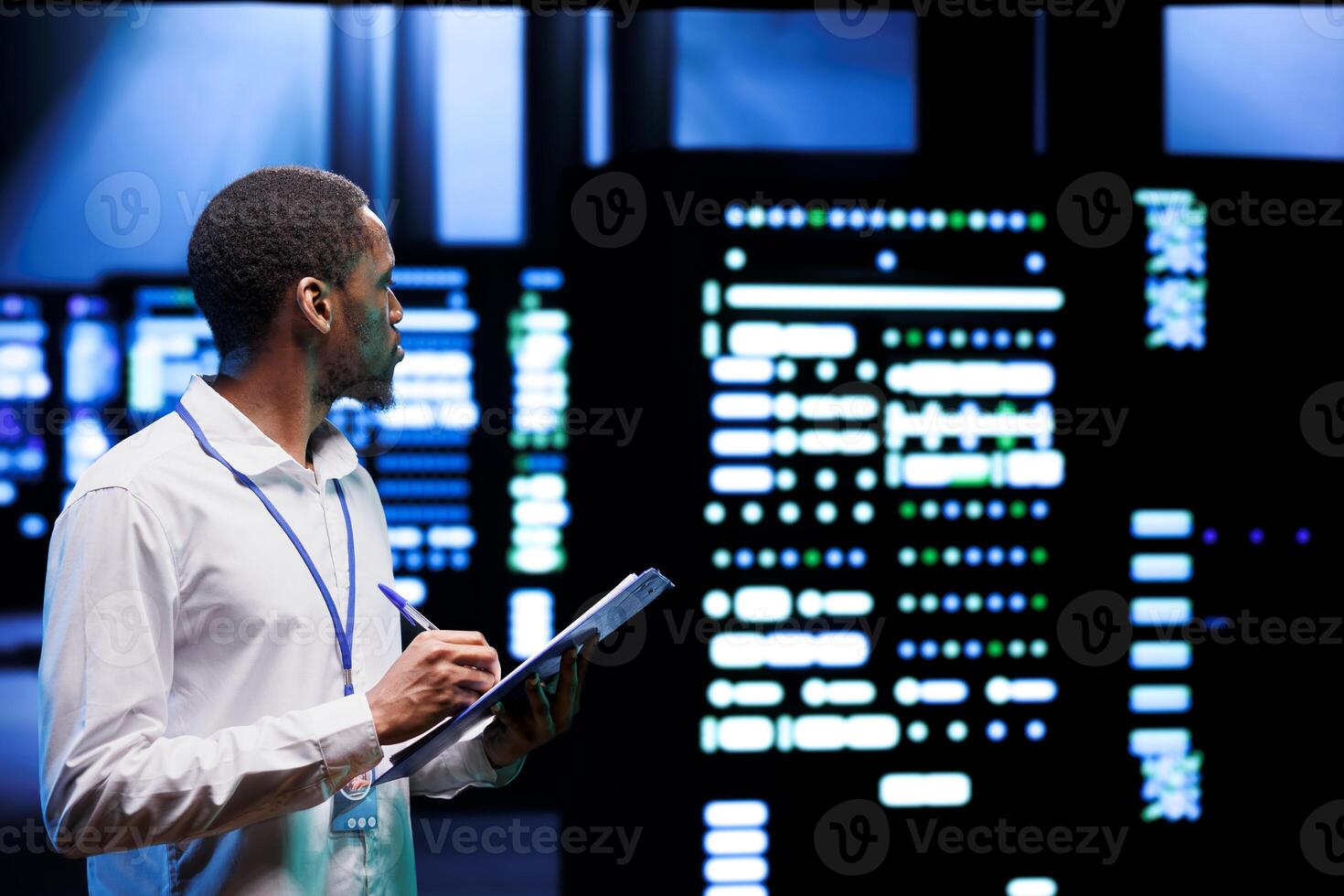 Experienced admin analyzing server systems performing data backups and providing centralized storage. Technician adjusting Uninterruptible Power Supply ensuring proper operating photo