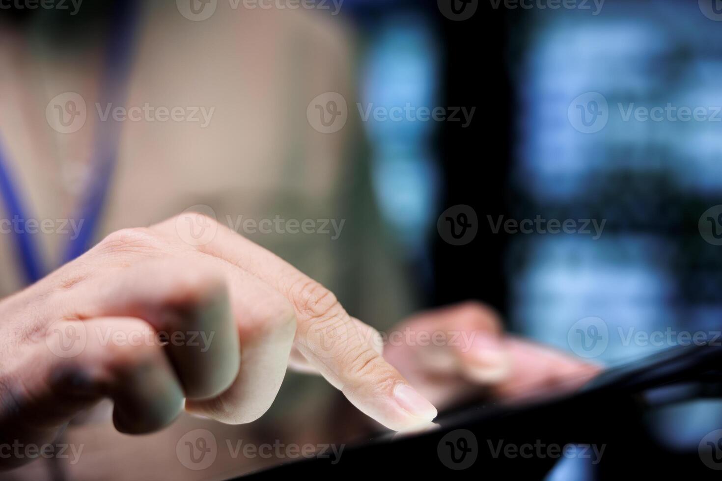 Meticulous mechaninc doing thorough system scan, typing data on tablet of needed repairs in blade servers housing advanced data storage equipment supporting complex computing operations, close up photo