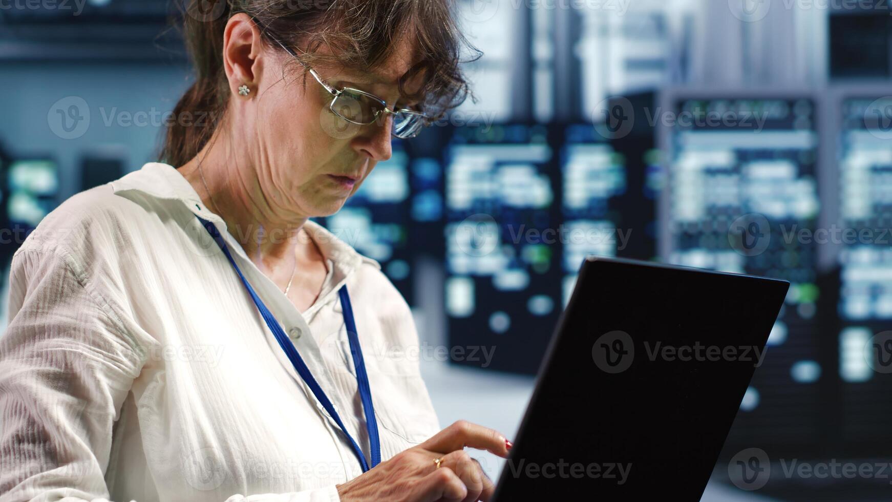 Meticulous specialist working in data center housing GPU dedicated rackmounts that can process AI tasks with high efficiency, servicing busted server parts used for machine learning photo