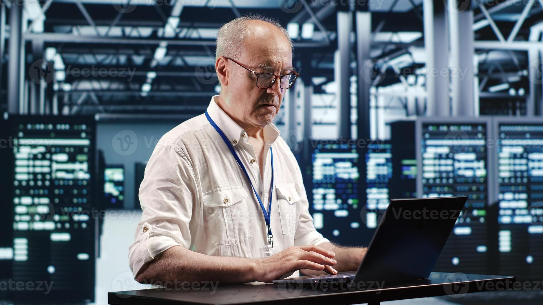 Certified technician expertly managing data while navigating in industrial server room. Professional ensuring optimal cybersecurity protection, optimizing systems and performing necessary updates photo