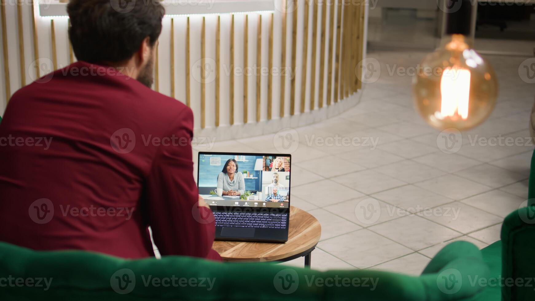 Gentleman on videocall meeting with clients, ensuring perfect services to help develop business sales. Entrepreneur using online telework call before conference, collaboration opportunities. photo