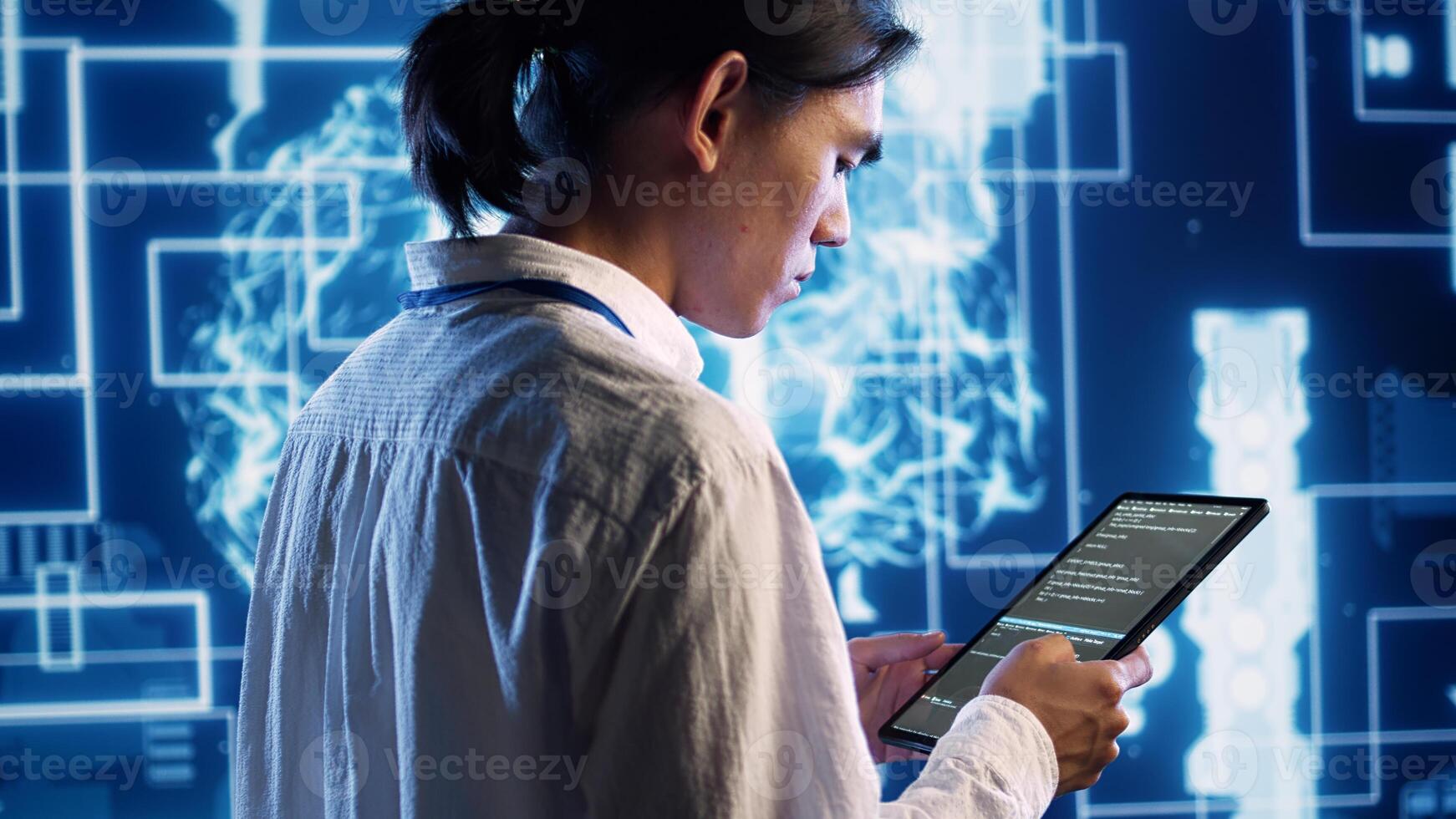 System administrator in data center running programming scripts on tablet, solving tasks. Experienced programmer manipulating lines of code for artificial intelligence applications development photo