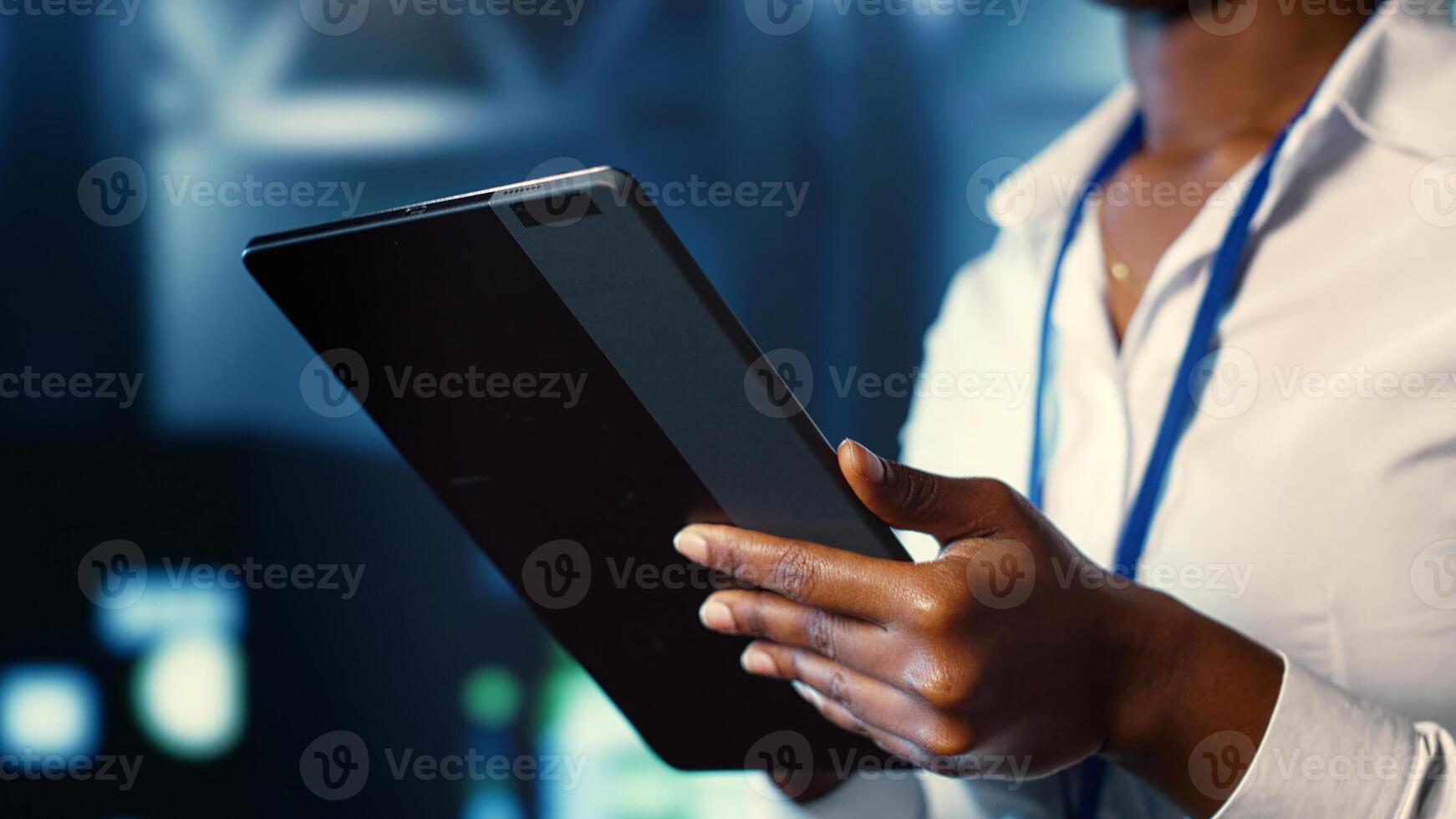 Woman walking through server room rows providing computing resources for different workloads. Admin investigating data center mainframes tasked with solving complex operations, close up photo