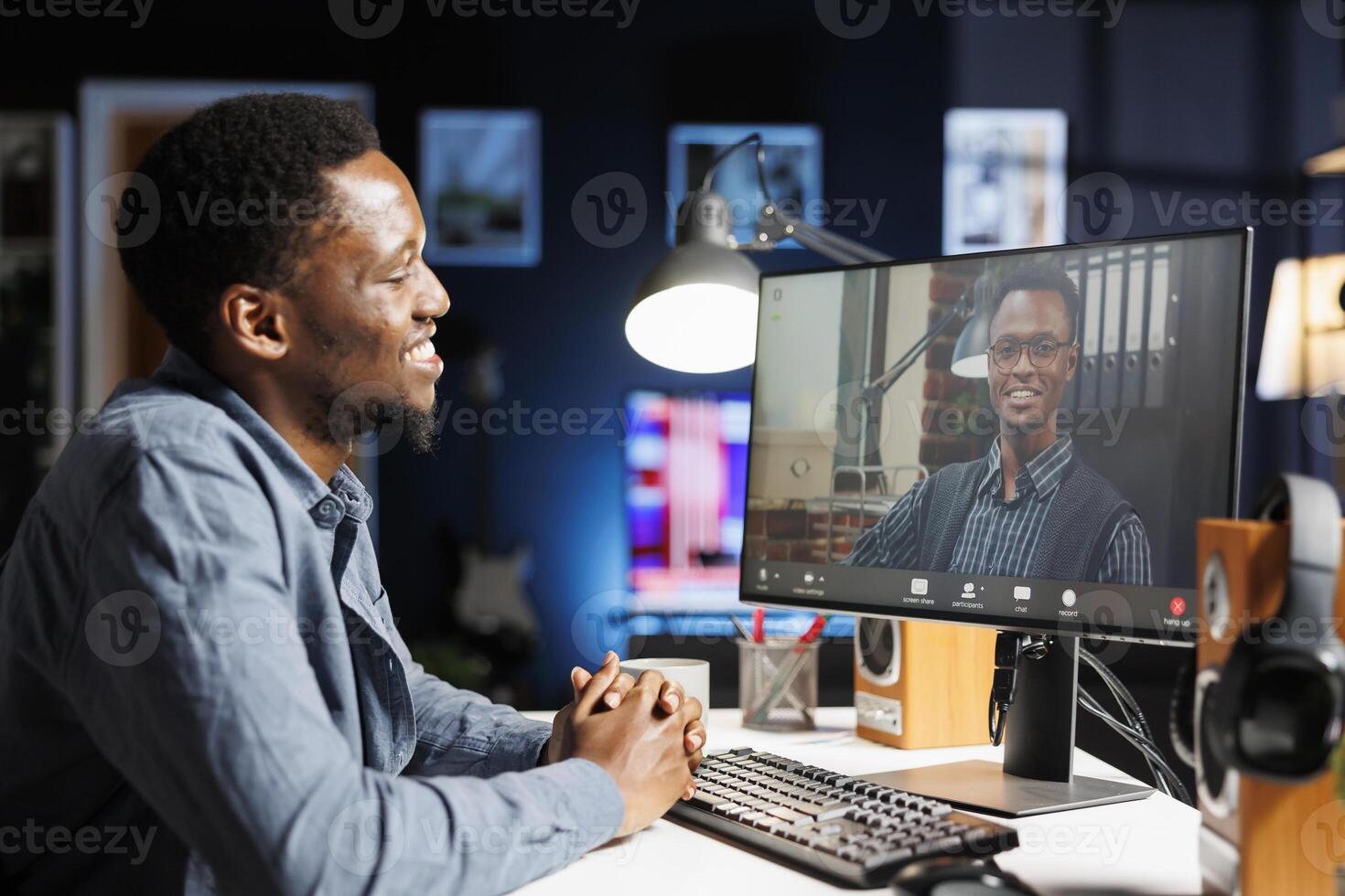 Job recruiter asking questions at online interview on videocall, meeting with young applicant on remote telework conference. Management staff having discussion with african american person. photo
