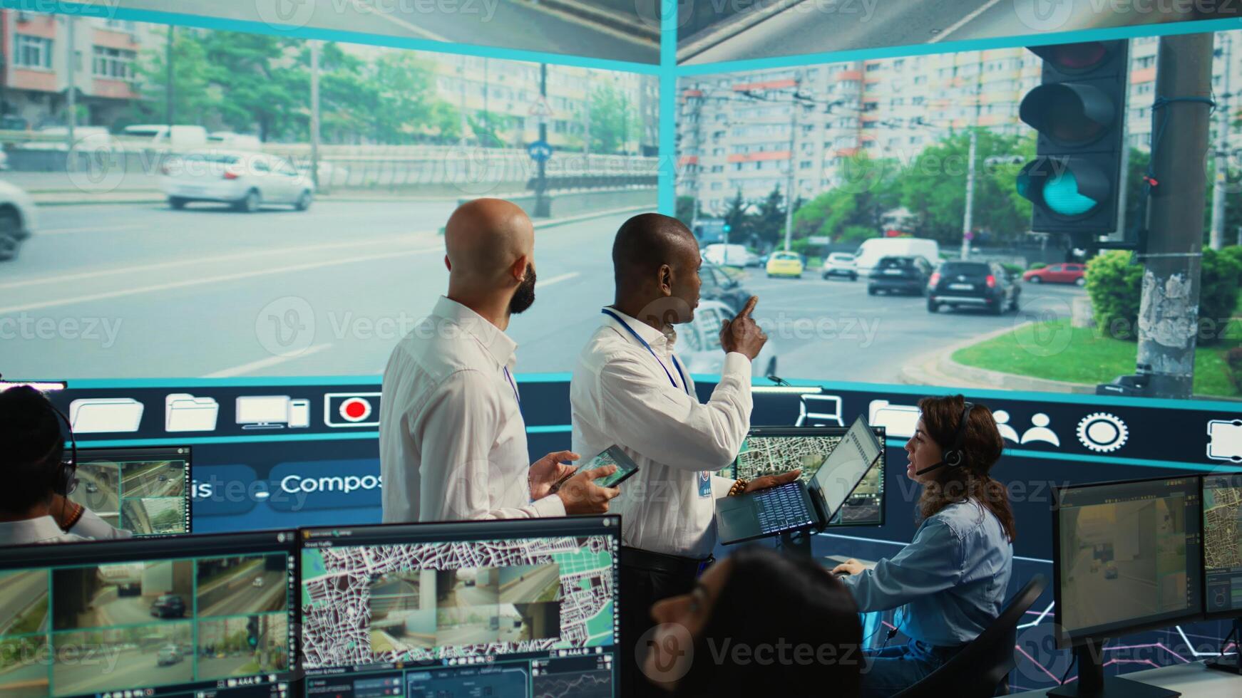 Experts monitoring real time urban traffic dynamics with help from surveillance footage and CCTV cameras. Government agency diverse employees tracking cars through gps satellite. Camera B. photo