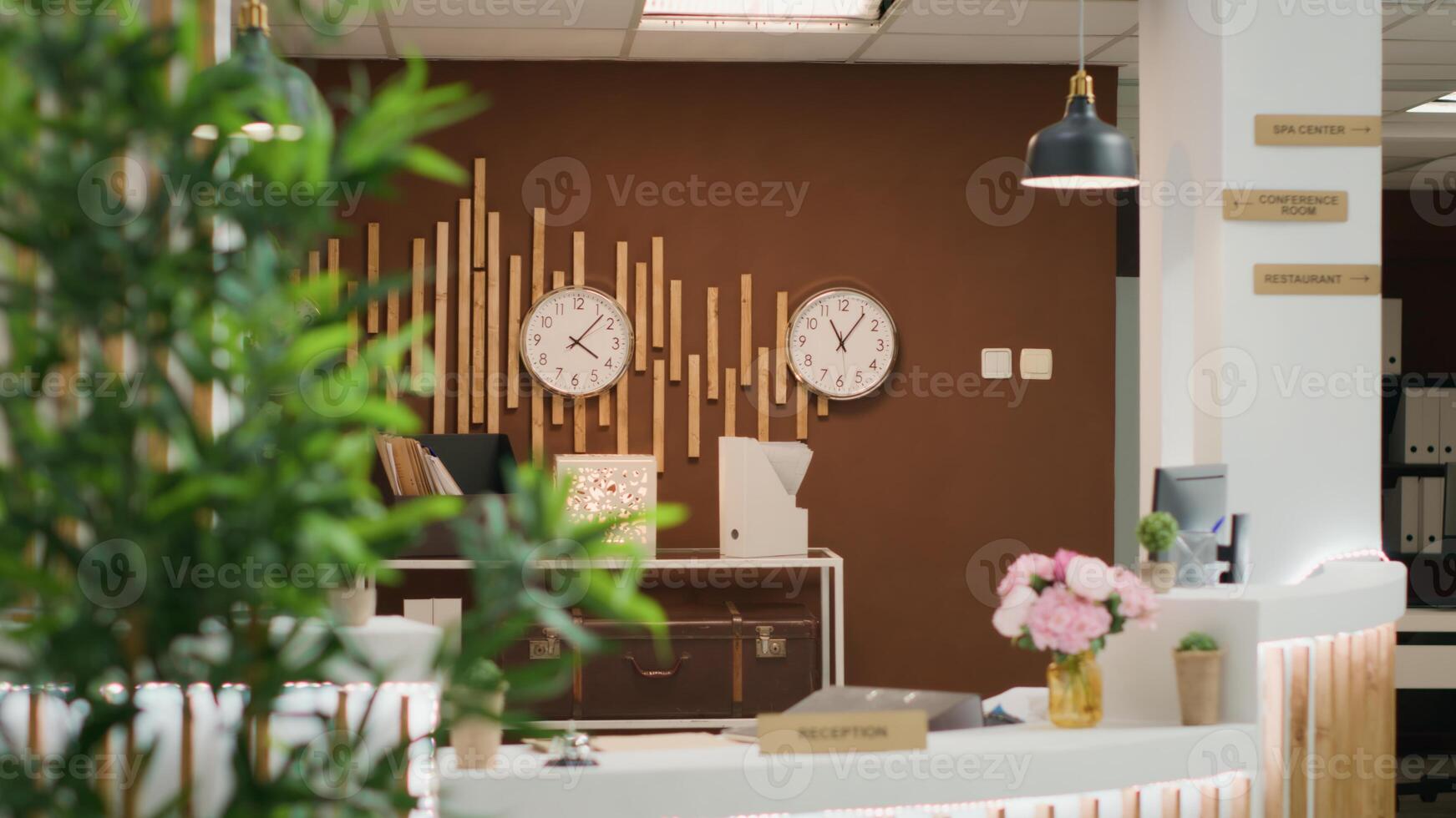 Empty stylish hotel lounge area with expensive decorations, cozy furniture and equipped front desk ready to welcome guests. Travel accommodation five star resort with check in reception. photo