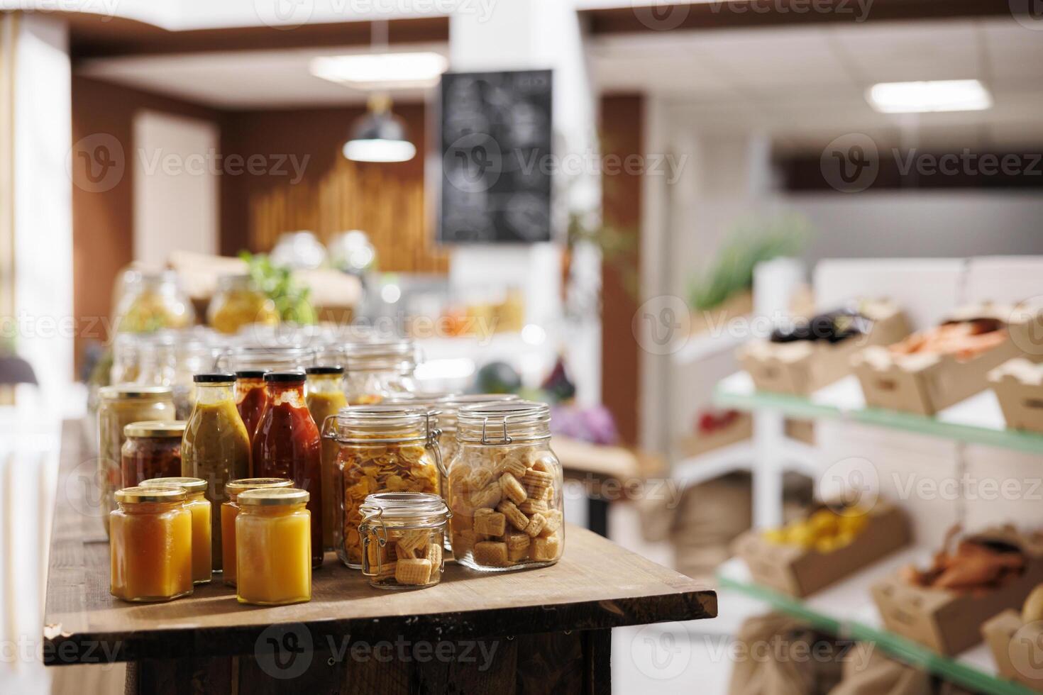 Products sold in bulk in zero waste store to minimize plastic usage, reducing pollution for a sustainable lifestyle. Ecofriendly pantry staples ready to be bought by consciously living customers photo