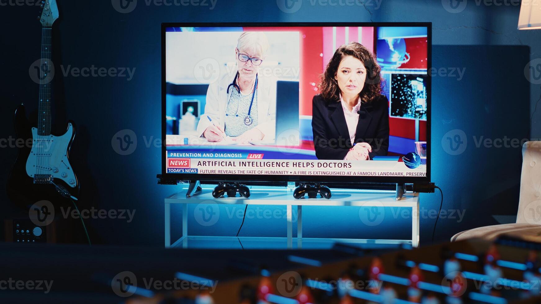 Close up shot of TV left open at night in cozy dimly lit apartment showing broadcast of news story. Home entertainment system showing television reports in living room, panning shot photo