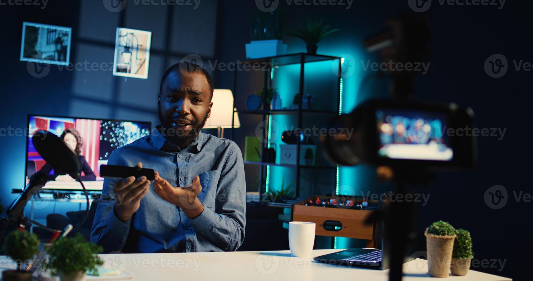 Content creator sponsored by tech brand to film review of their newly released smartphone. Influencer showing phone recommendation to fanbase doing research before purchase photo