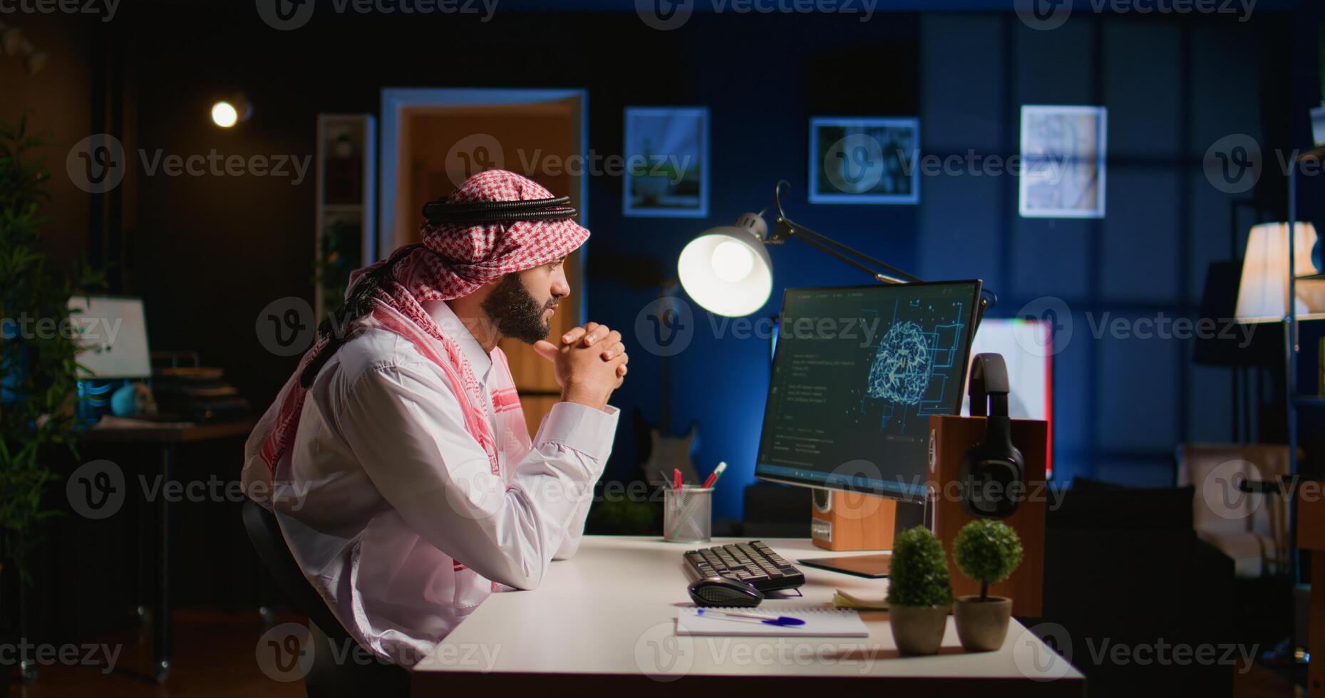 Licensed arabic engineer updating neural networks, writing intricate binary code scripts on computer. Middle Eastern man uses digital device programming to upgrade AI datasets at home photo