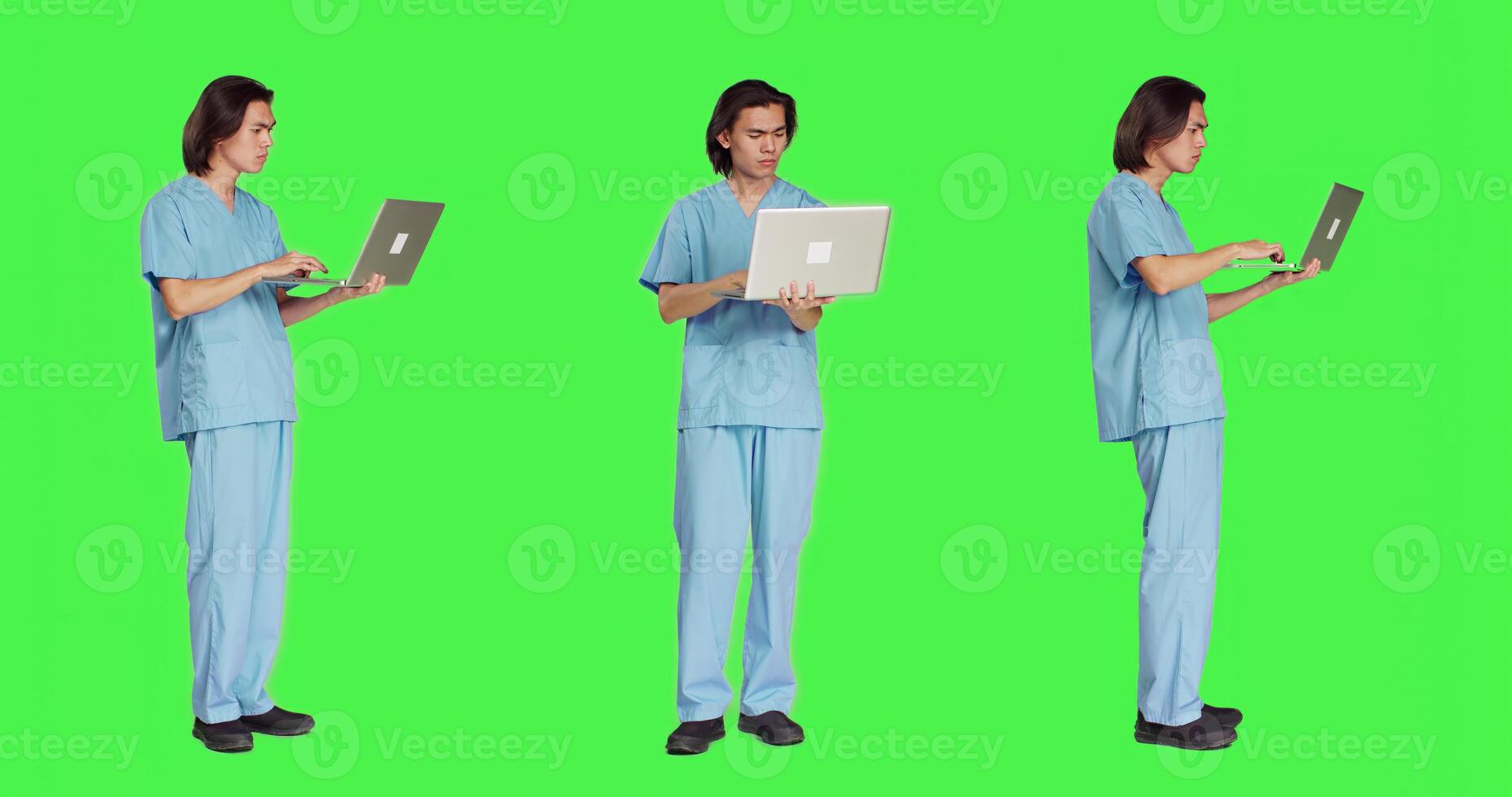 Young nurse reading patient information on pc, using wireless computer before starting healthcare checkup at clinic. Man assistant working in medical industry, using laptop on greenscreen. photo