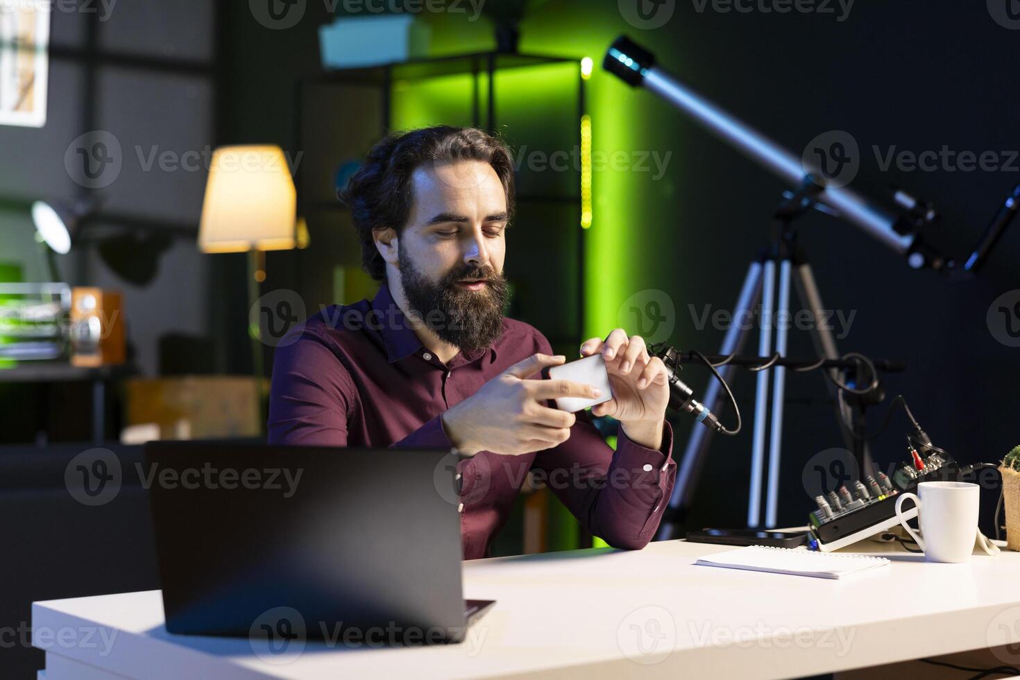 Tech expert in studio filming technology review of mini led lights, trying to turn it on. Internet star showing broken filming equipment to subscribers, struggling to make it work photo