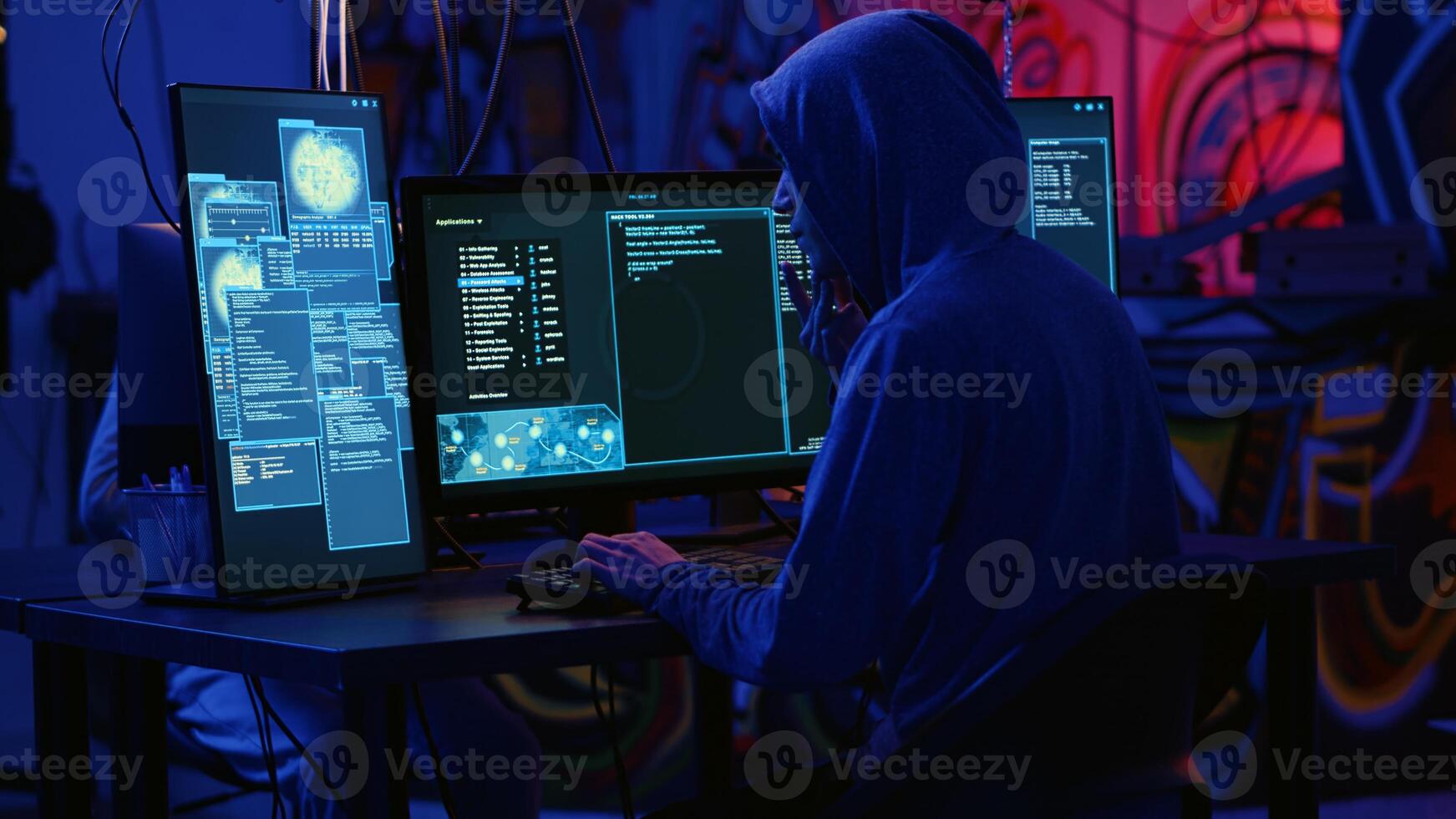 Hackers in dark room running code to breach defenses and exploit weaknesses in computer systems. Evil developers in basement getting past companies security networks, handheld camera shot photo