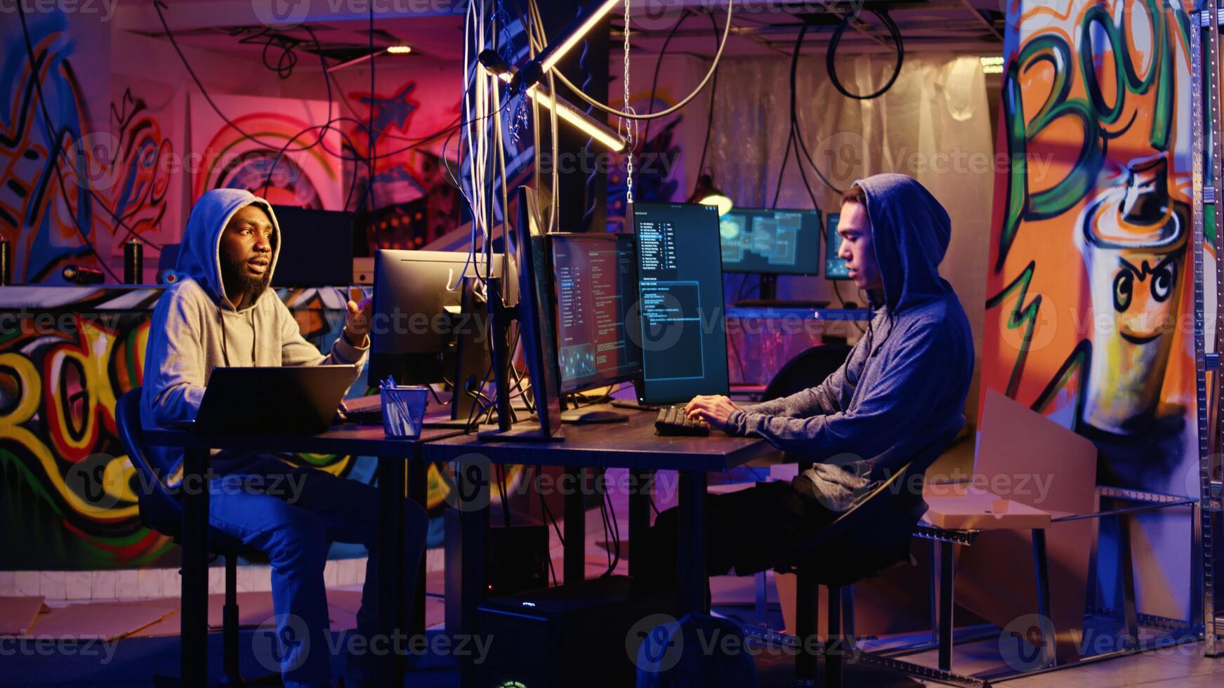 Hackers developing zero day exploit undetectable by antivirus software installed on systems in order to steal valuable data from users. Rogue programmers in hideaway look for ways to trick firewalls photo