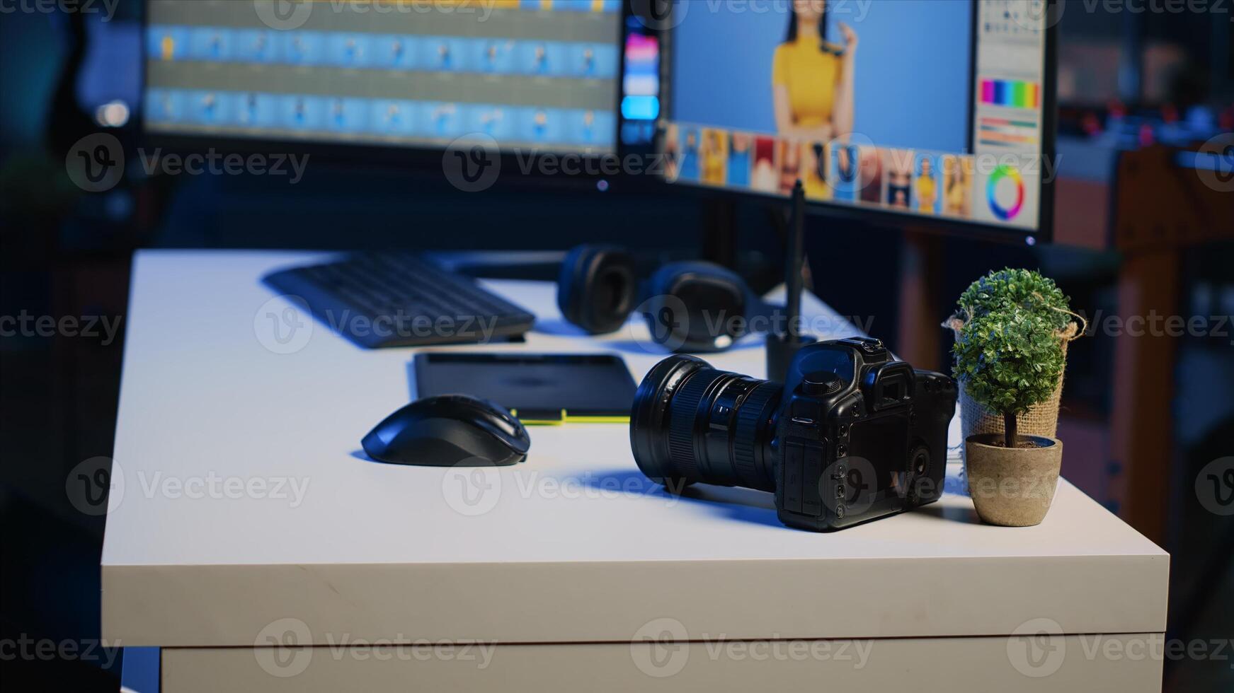 Photo editing software interface on desktop computer in empty photography studio. Photography organizing program displayed on multi monitors PC setup on media agency desk, panning shot