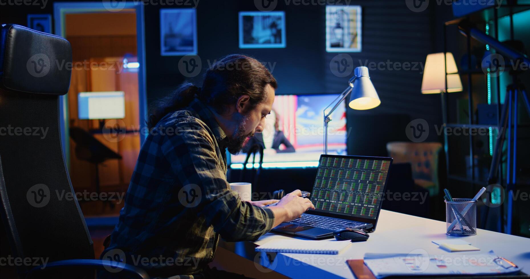 Happy broker investor excited about high stock exchange income after calculating profit using pen and paper. Cheerful freelancer celebrating in apartment after noticing market shares growth, camera B photo
