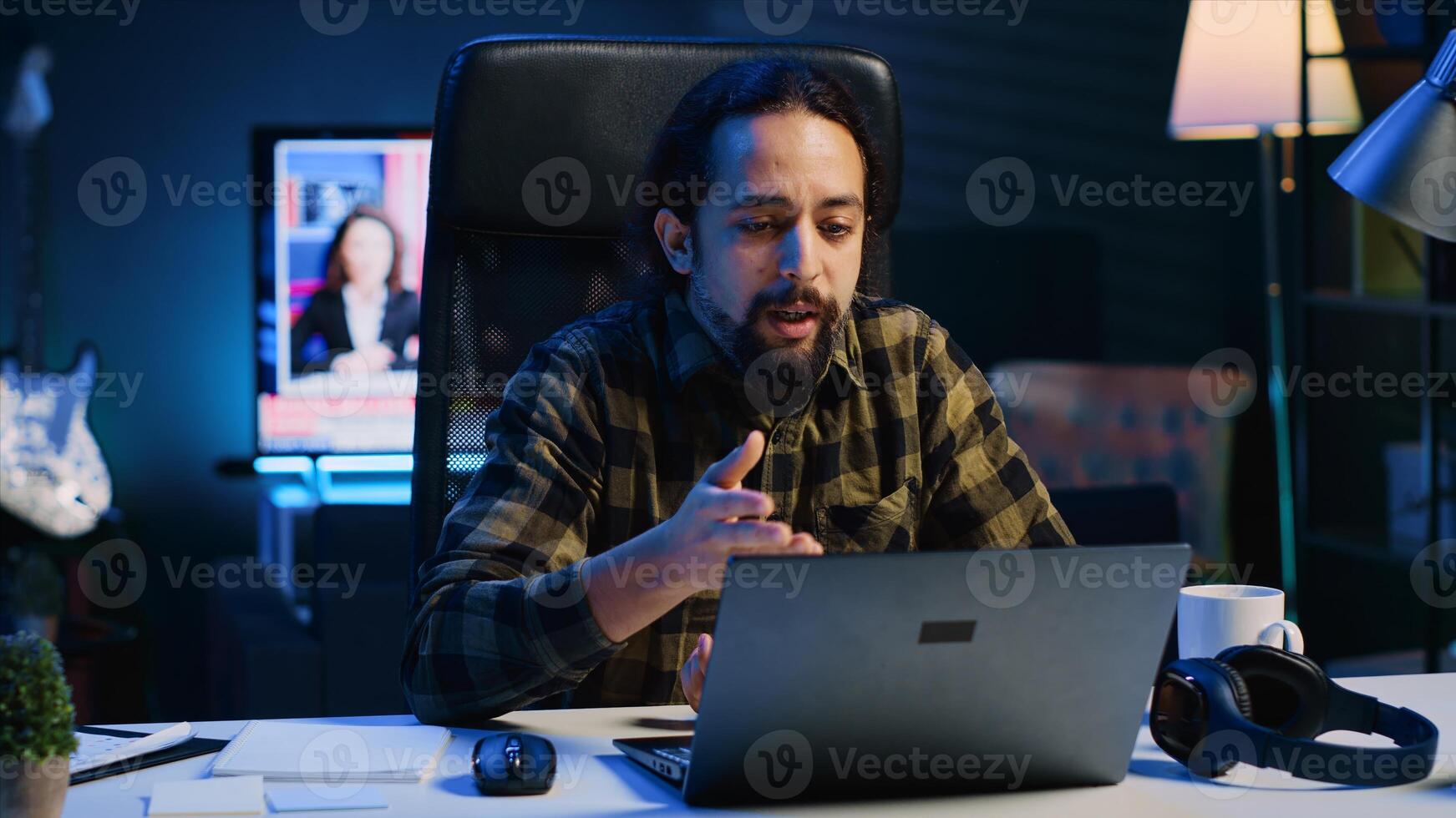 Man in call session with therapist, asking for advice, feeling down. Remotely working employee in online consultation with psychologist from stylish cozy home, greeting him, camera A photo