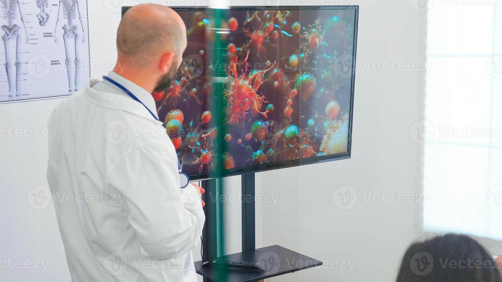 Medical specialist talking about coronavirus during presentation in front of expert doctos. Specialist doctor discussing with colleagues about global pandemic because of dangerous virus, symptoms photo