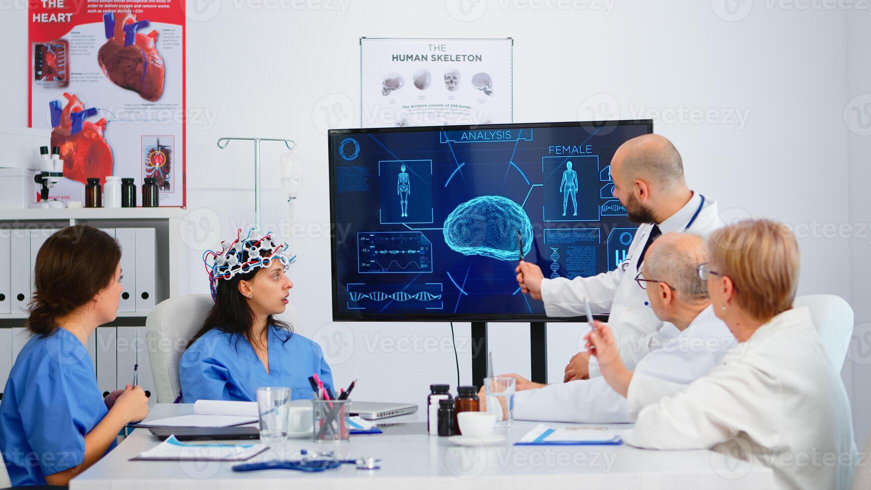 Group of specialist doctors analysing brain functions using high tech in medical boardroom, nurse testing new innovation. Medic studying diagnosis of patients working in hospital conference room photo