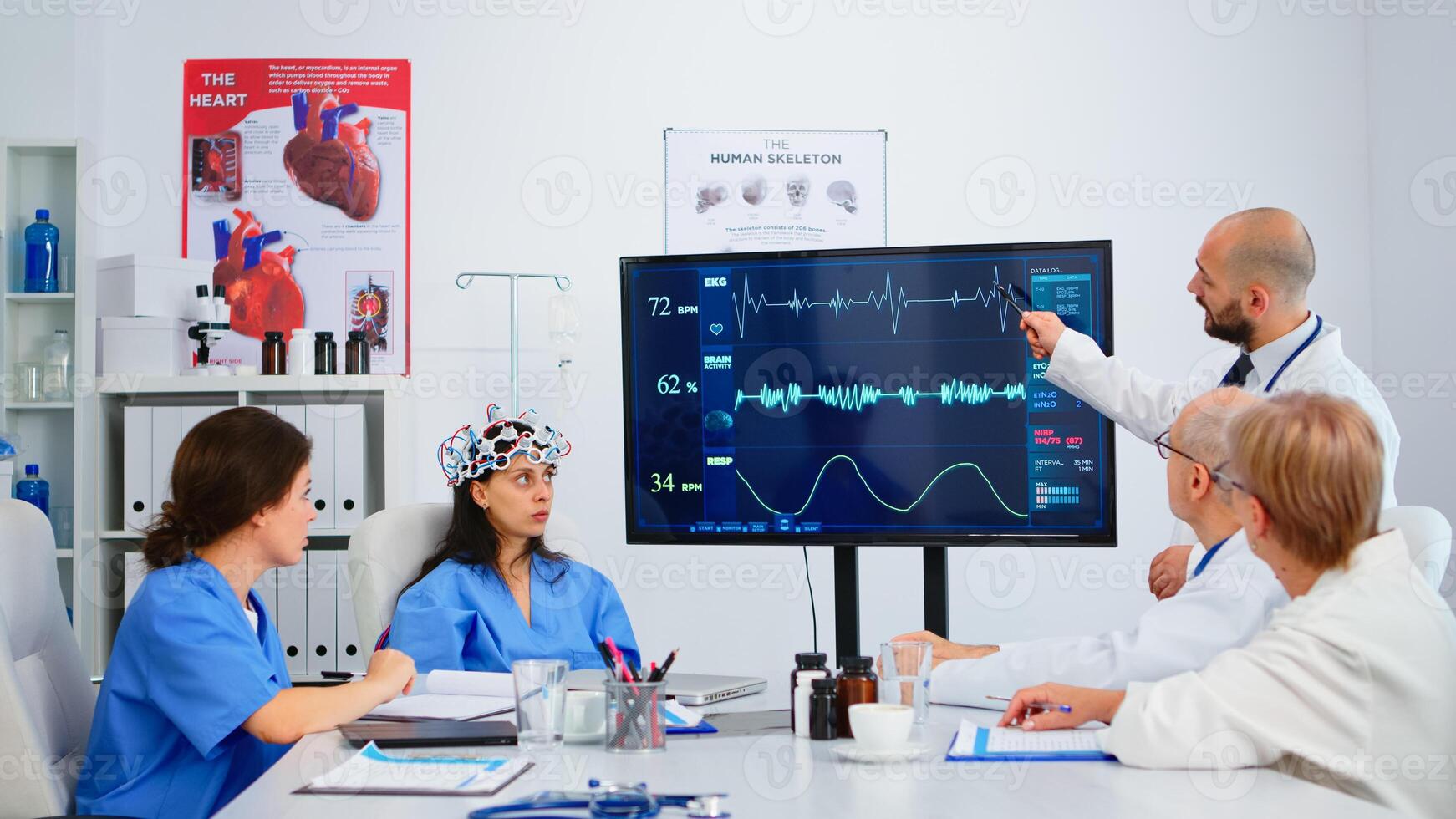 Medic researcher using high technology analysing brain impulse in medical boardroom, young doctor testing new innovation. Doctors studying diagnosis for treatment of patients working in hospital photo
