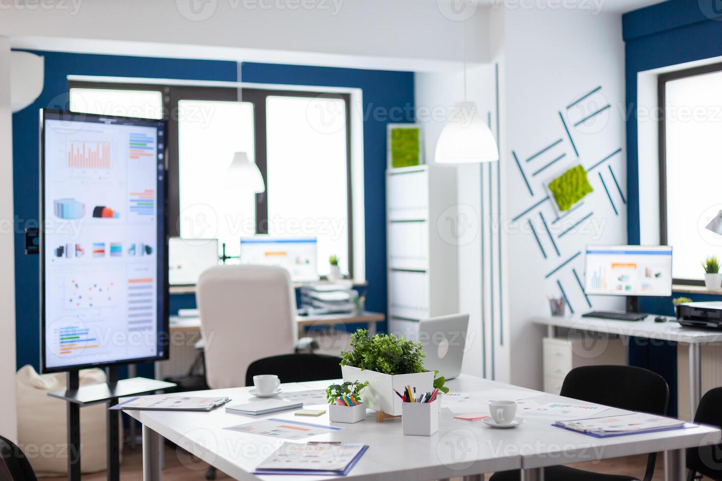 Empty start up business office, cozy light company room with conference table ready for brainstorming, modern design for meeting room. Company with modern design and conference table ready for brainstorming with nobody in room photo