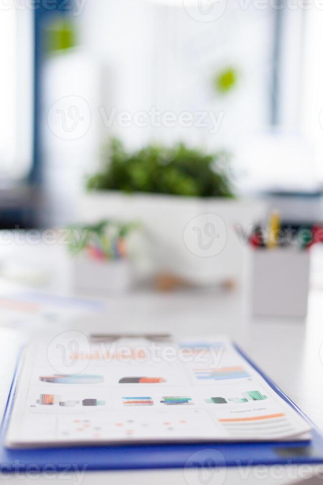 Brainstorm area in business center with nobody in it, shot of empty room with modern furniture. Company with modern design and conference table ready for brainstorming with nobody in room photo