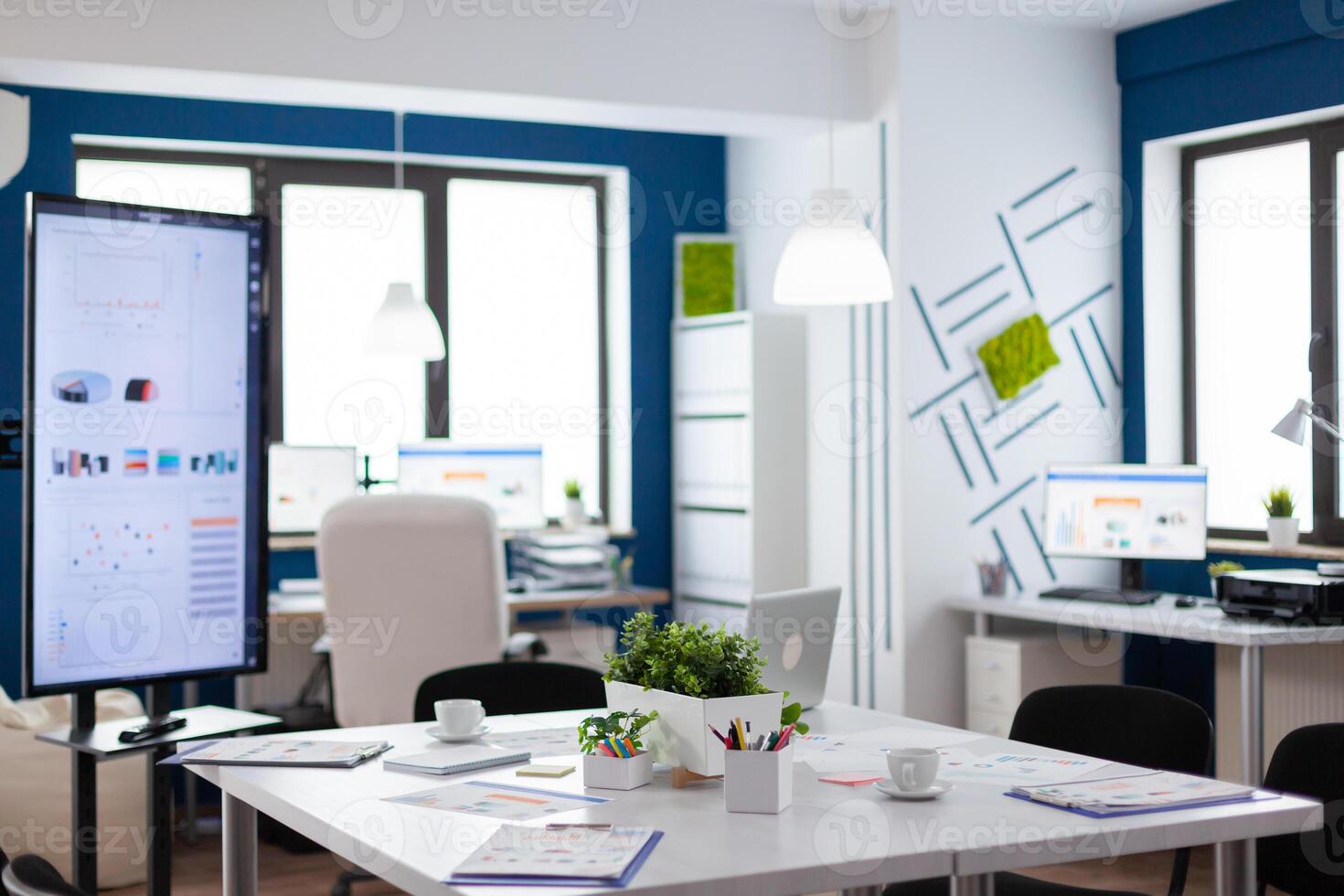 Empty start up business office, cozy light company room with conference table ready for brainstorming, modern design for meeting room. Company with modern design and conference table ready for brainstorming with nobody in room photo