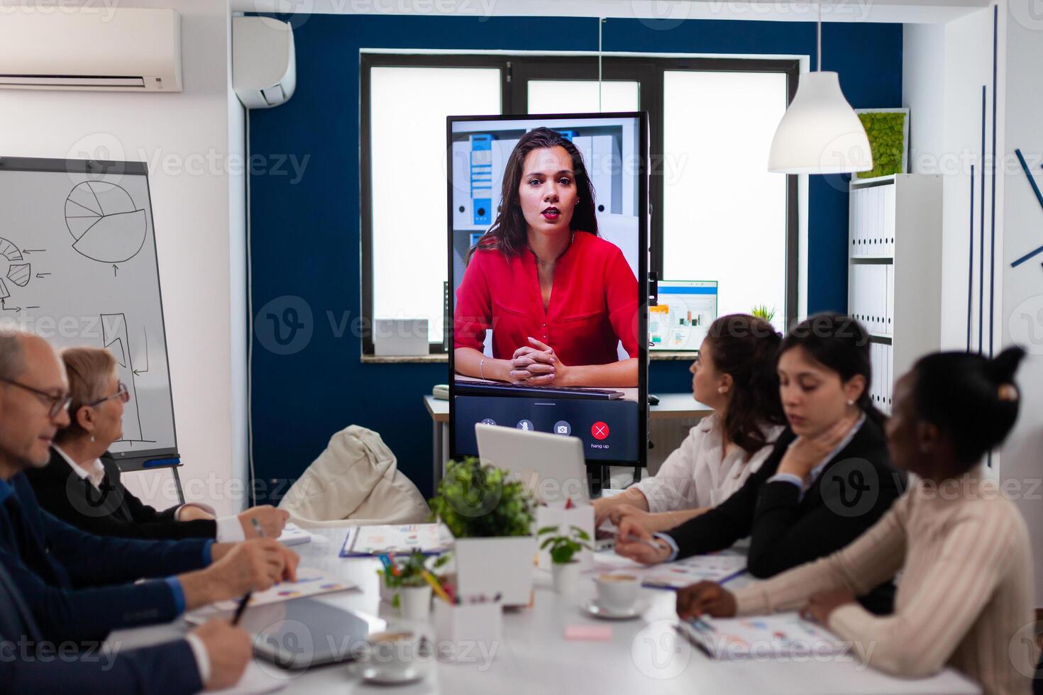 Young ceo speaking to camera during virtual business presentation for business partners. Business people talking to webcam, do online conference participate internet brainstorming, distance office discussion photo