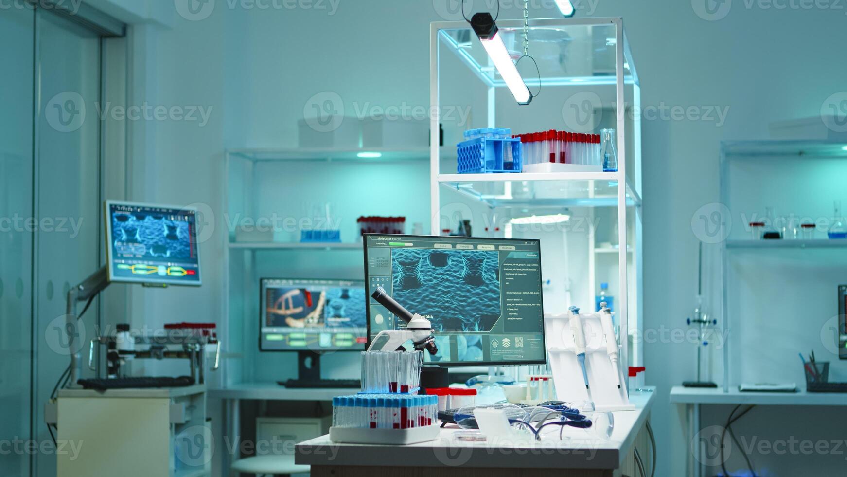 Interior of modern science laboratory with no people prepared for pharmaceutical innovation late at night using high tech, microbiology tools for scientific research. Vaccine against covid19 virus photo