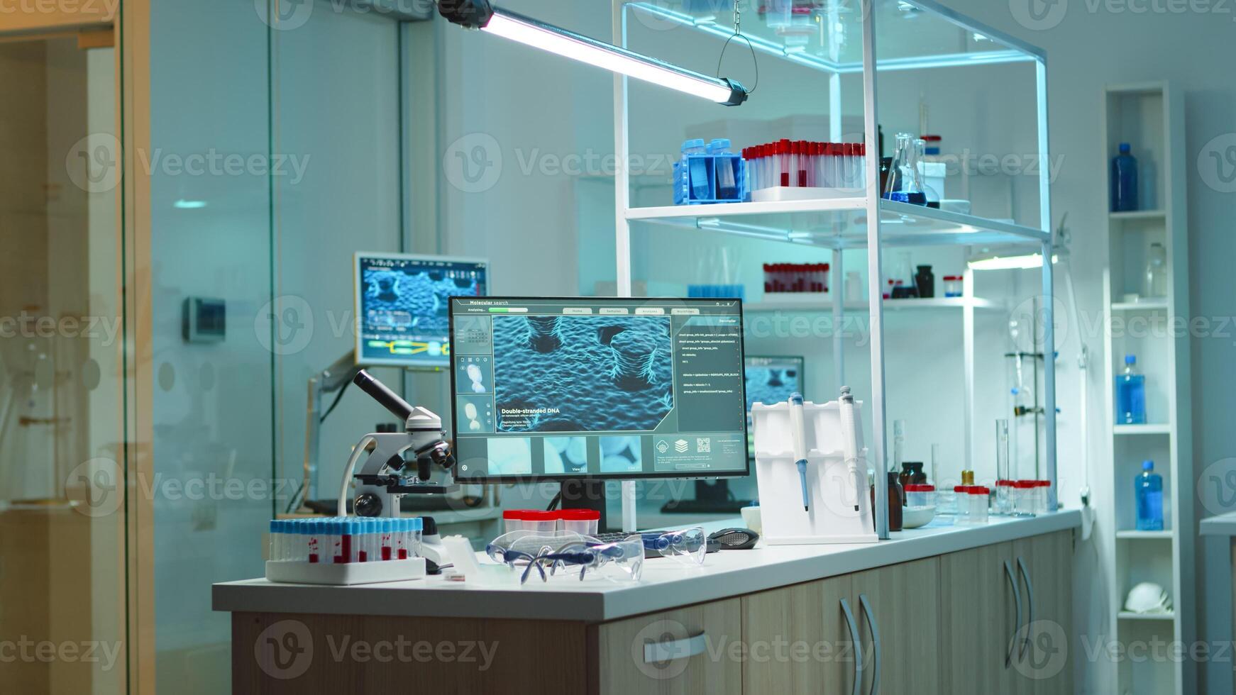 Interior of empty science laboratory with modern equipment prepared for medical innovation late at night using high tech, microbiology tools for scientific research. Vaccine against covid19 virus photo