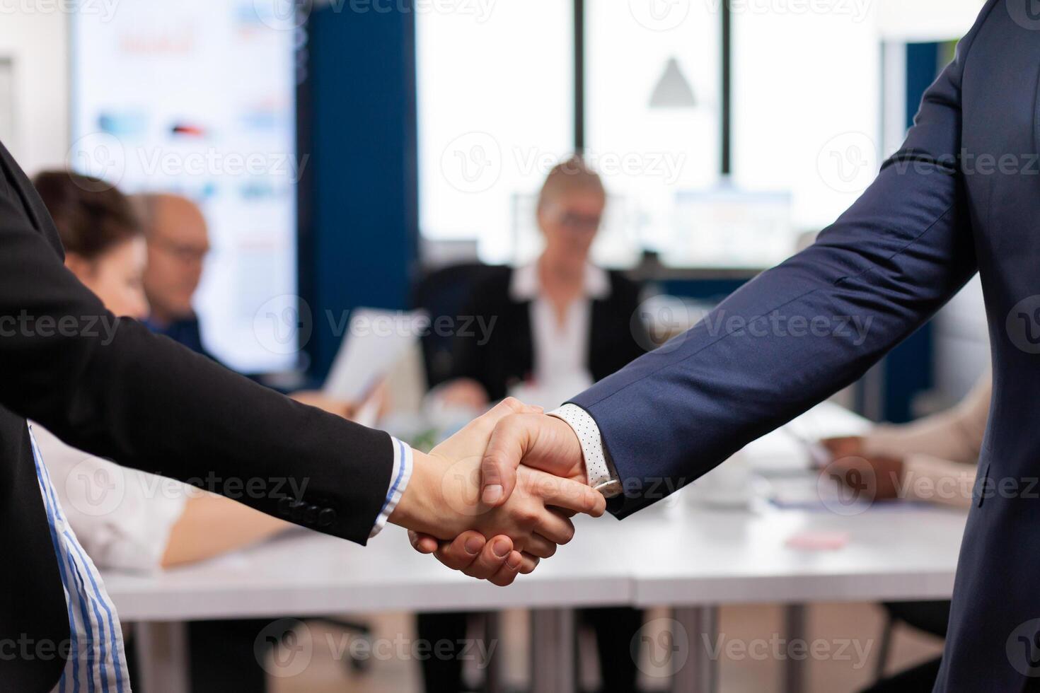 Satisfied businessman company employer wearing suit handshake new employee get hired at job interview, Man hr manager employ successful candidate shake hand at business meeting, placement concept photo