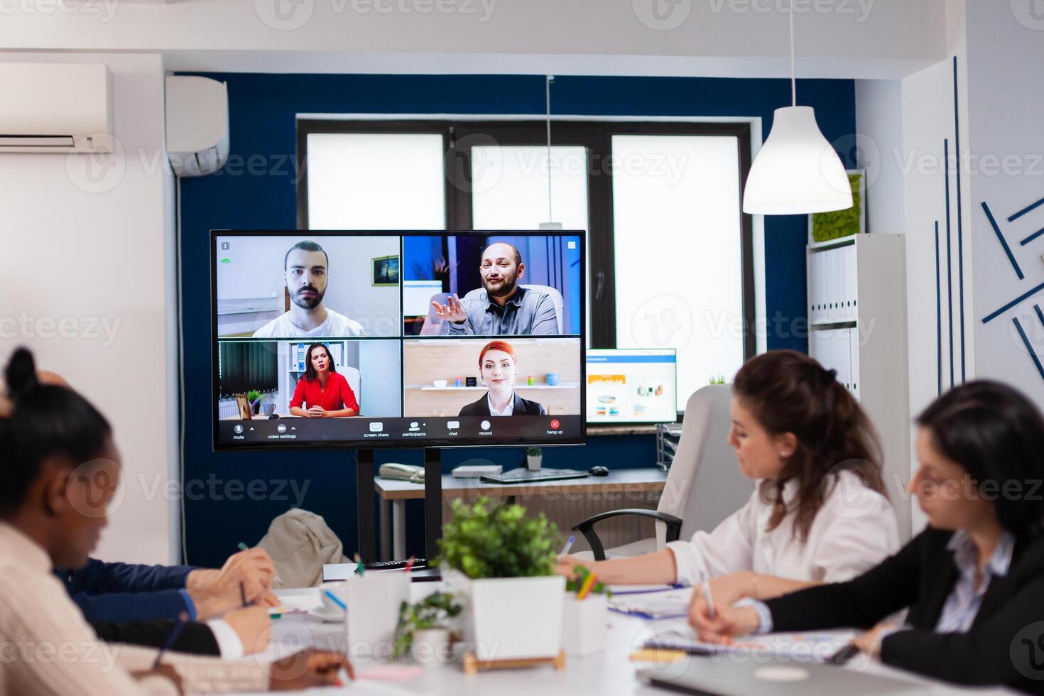 Emplyees workers having webcam group conference with coworkers speaking on call. Business people talking to webcam, do online conference participate internet brainstorming, distance office discussion. photo