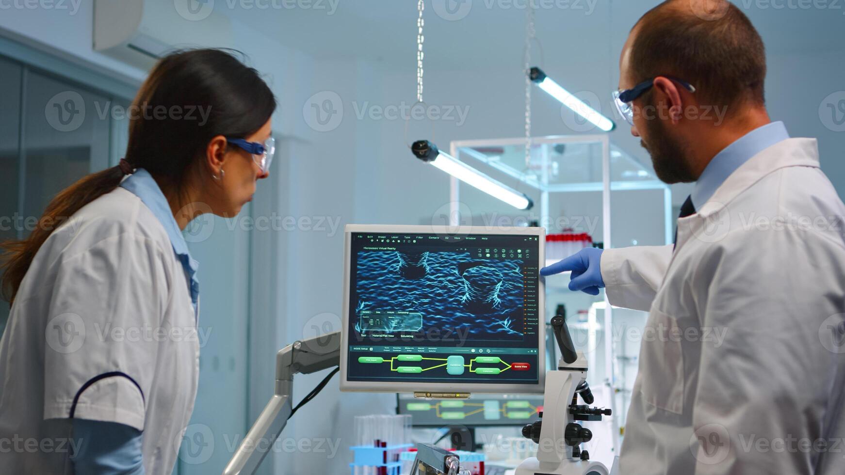 Lab technicians making pharmaceutical research for antibiotics, curing disease with DNA enhancing drugs working at night. Team examining virus evolution using high tech for treatment against covid19 photo