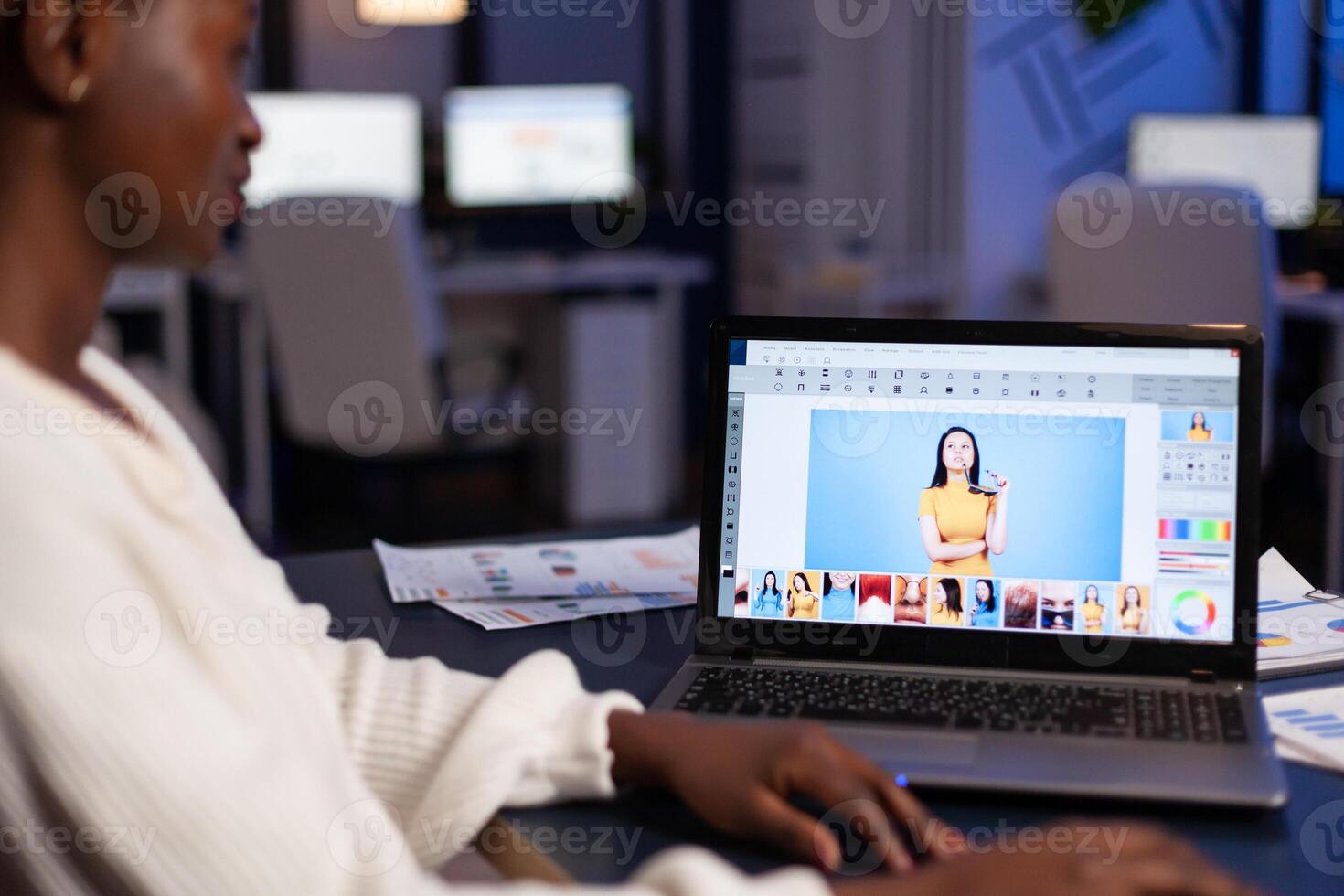 Exhausted african photographer editor retouching artist deadline project editing photography working late at night in company office. Creative retoucher using creativity design software technology photo